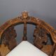 19th century walnut corner armchair with carved angel decoration