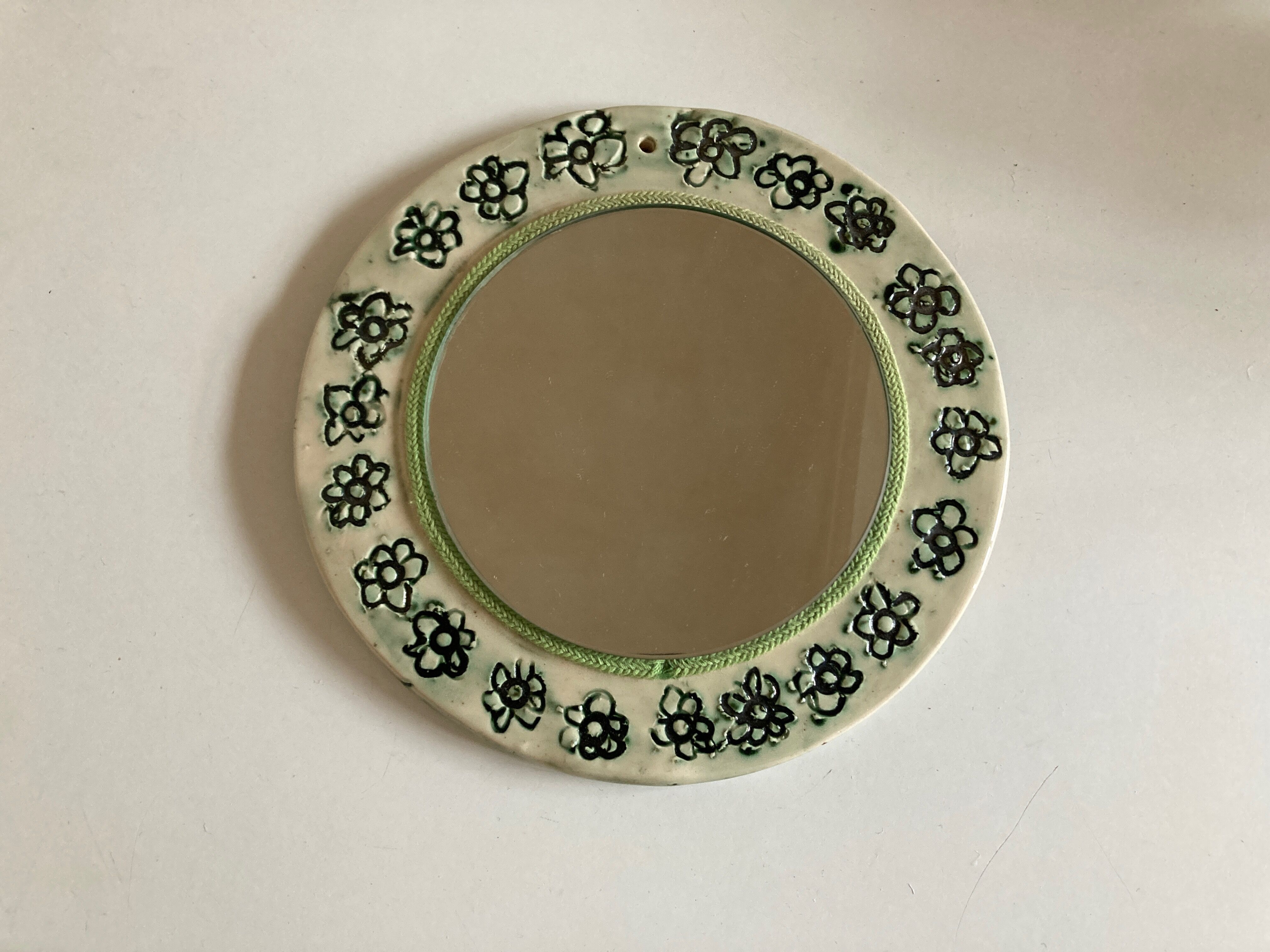 Incised ceramic mirror with flowers 1960