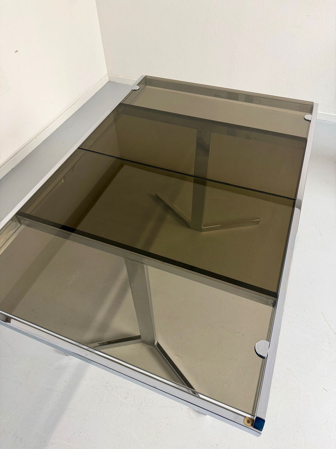 Smoked glass dining table with chrome legs, 1970s design by Roche Bobois.