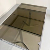 Smoked glass dining table with chrome legs, 1970s design by Roche Bobois.