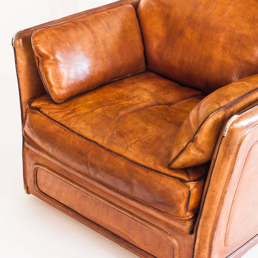 Vintage club armchair by Roche Bobois. Camel buffalo leather. France, 1980s.