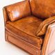 Vintage club armchair by Roche Bobois. Camel buffalo leather. France, 1980s.