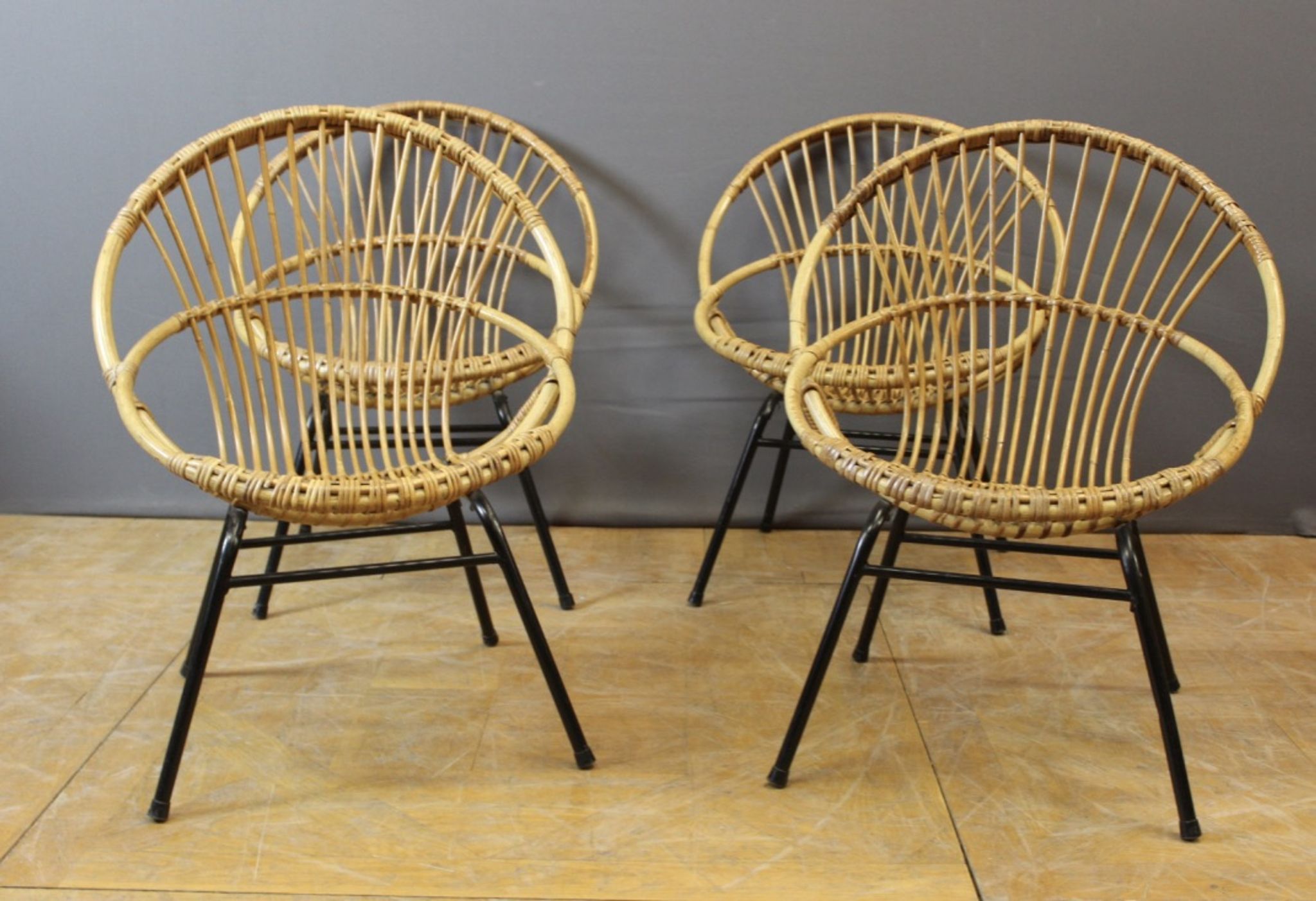 Living room in rattan and black lacquered iron by Rohe Noordwole circa 1950