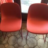Red muuto "visu" chairs with sled base