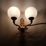 Wall light in gilded bronze and opaque glass globe