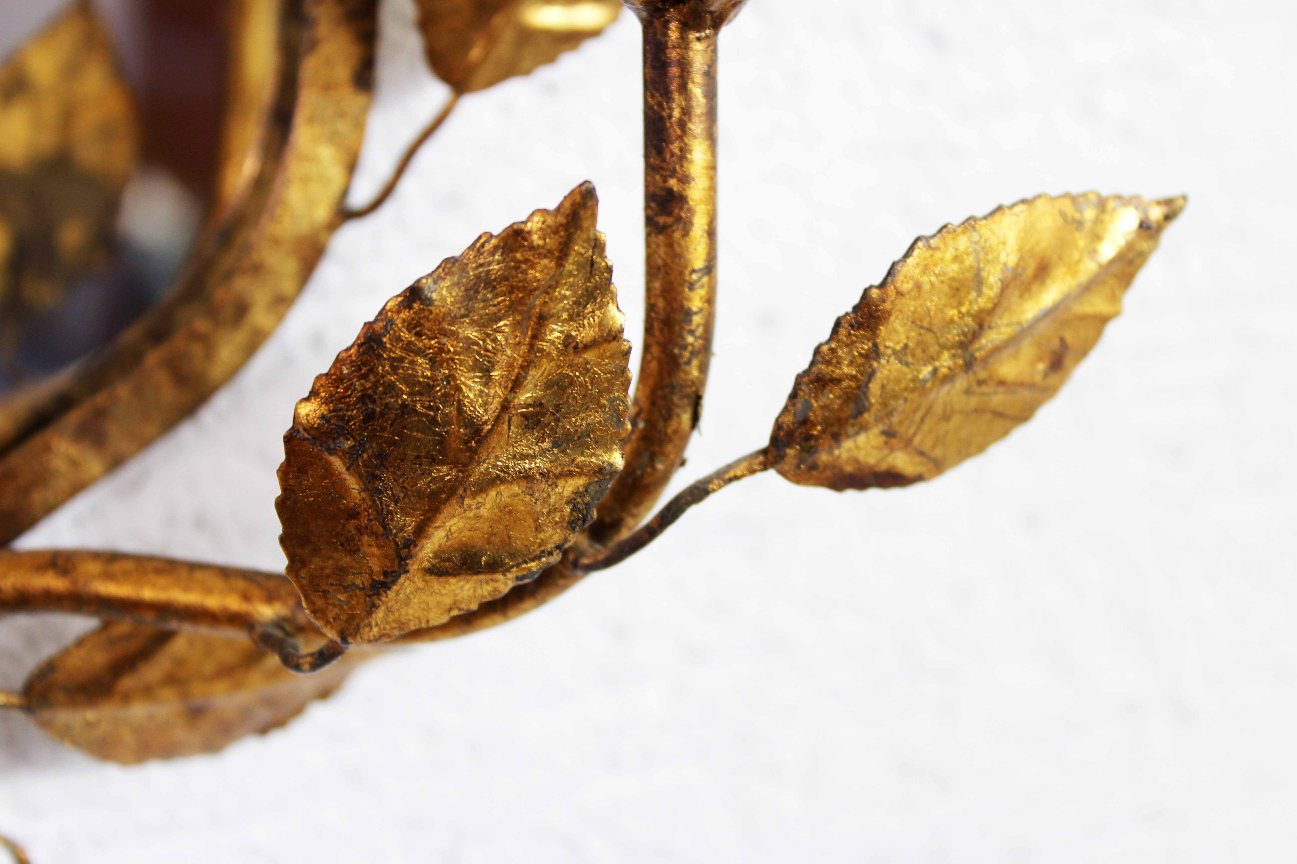 Old candlestick mirror gilded with leaf
