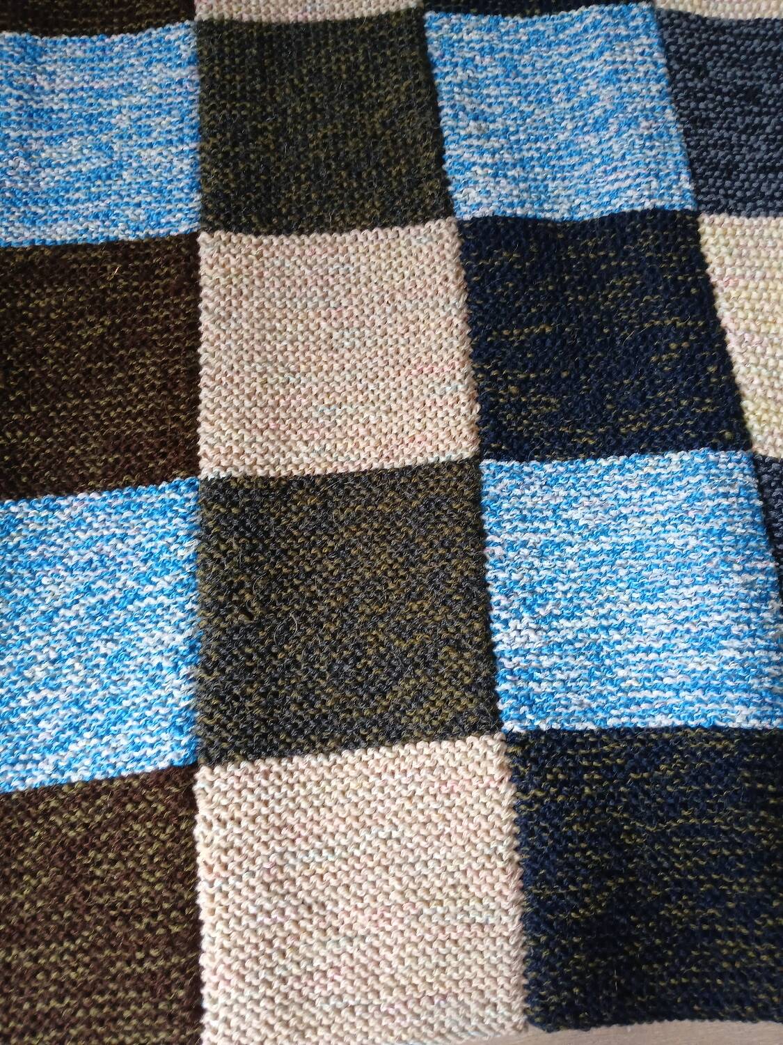 Hand knitted patchwork plaid