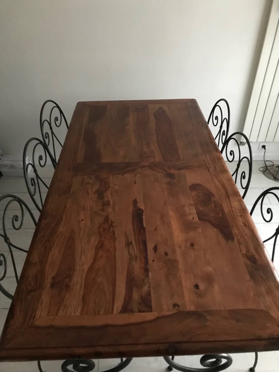 Wrought iron table with wooden top and 6 chairs