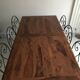 Wrought iron table with wooden top and 6 chairs