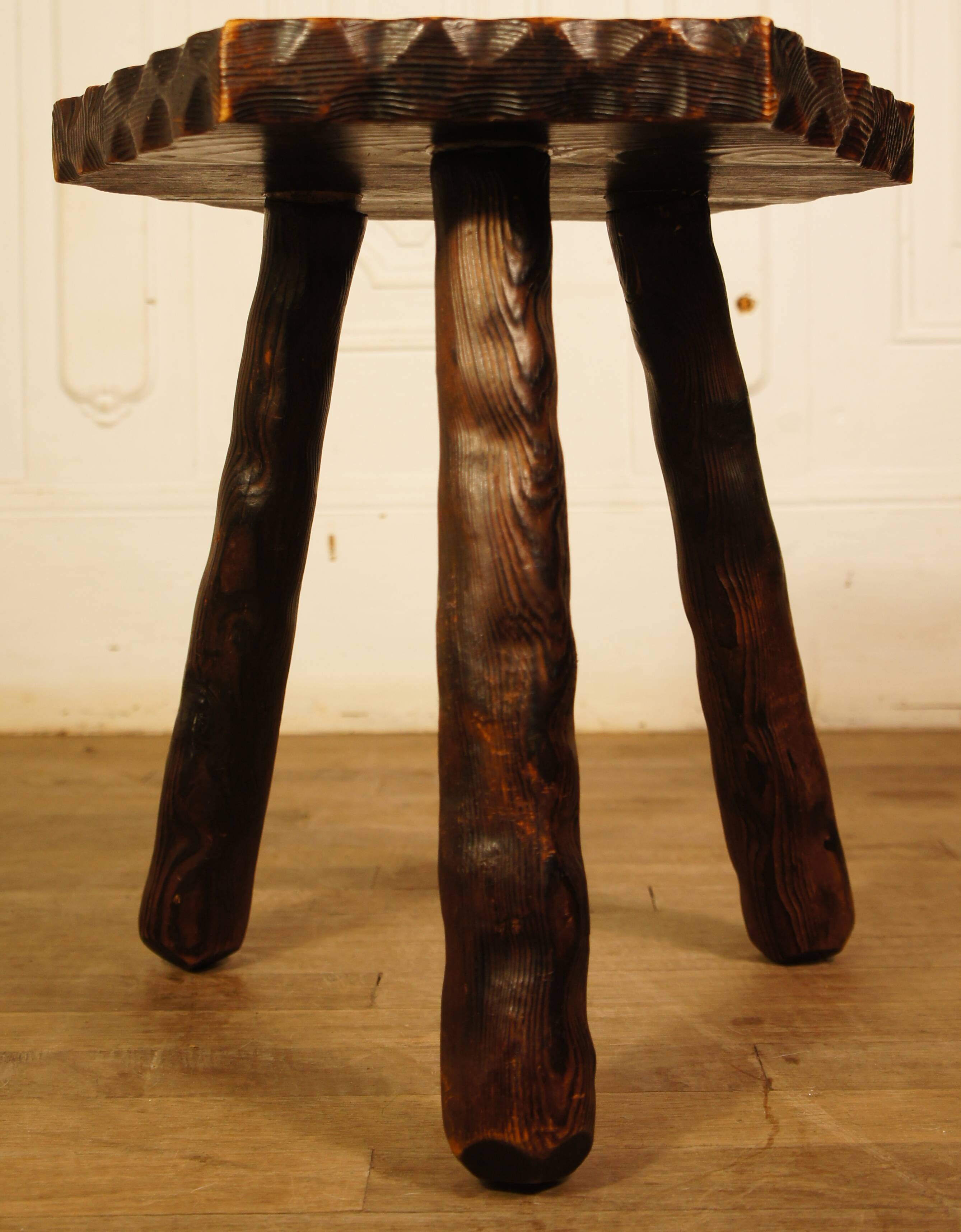 Brutalist tripod stool cut with gouge