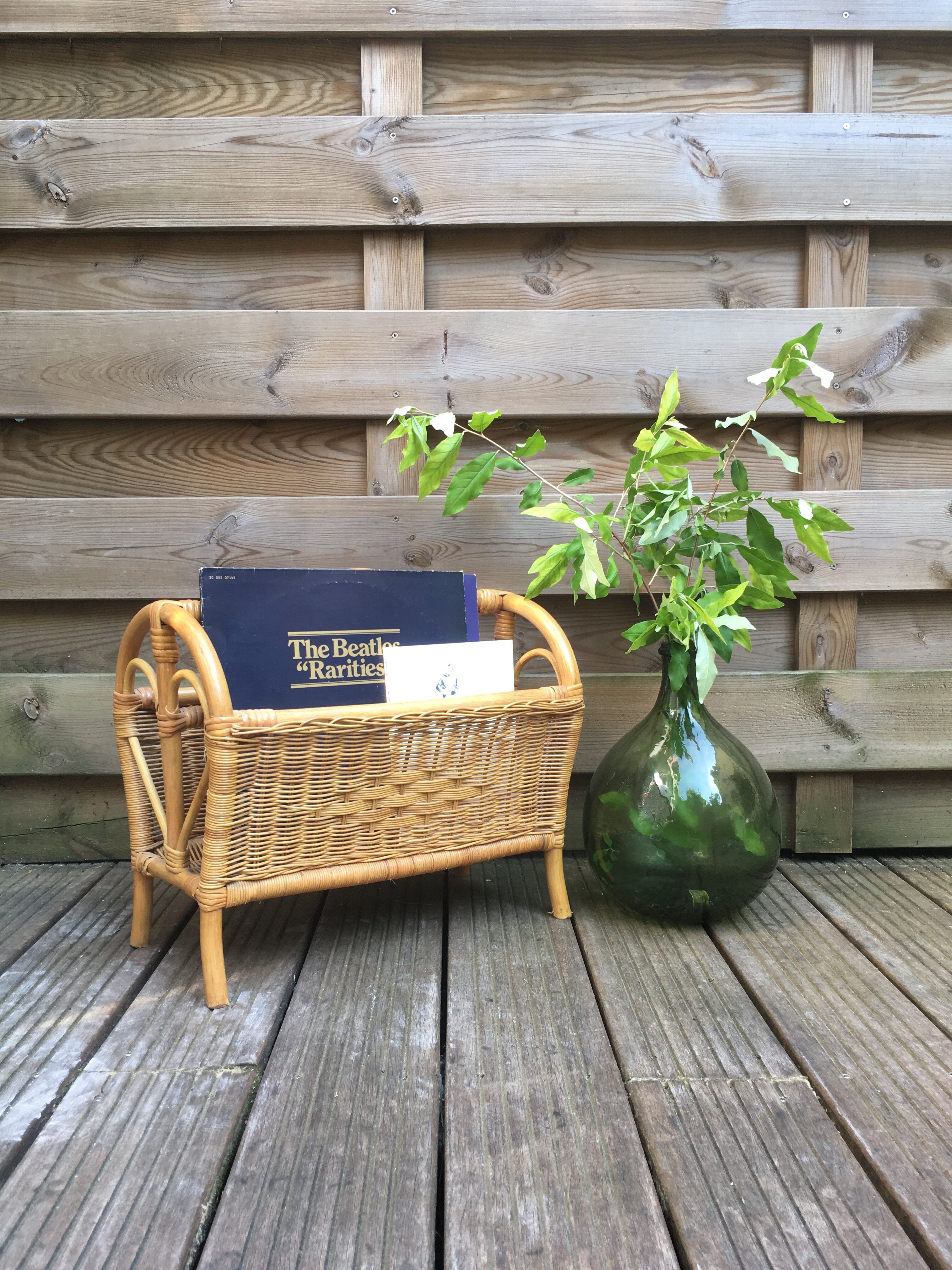 Old rattan magazine rack