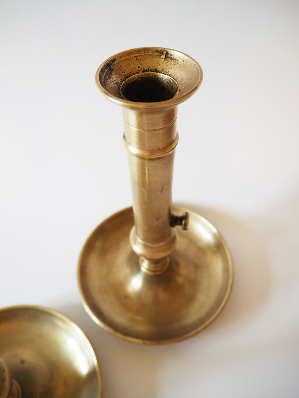 Set of three old brass candle holders