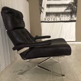 Grained leather armchair with rocking movement