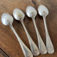4 teaspoons in silver metal