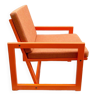 Orange designer armchair by Terence Conran