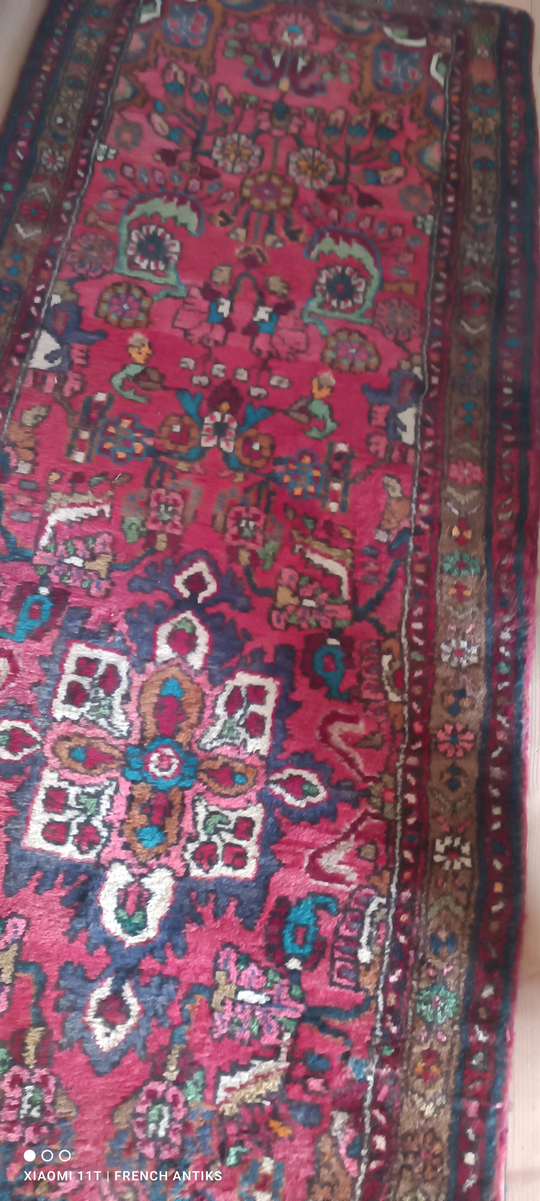 Vintage oriental rug from the 1930s. Handcrafted, handmade. Worn.