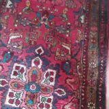 Vintage oriental rug from the 1930s. Handcrafted, handmade. Worn.