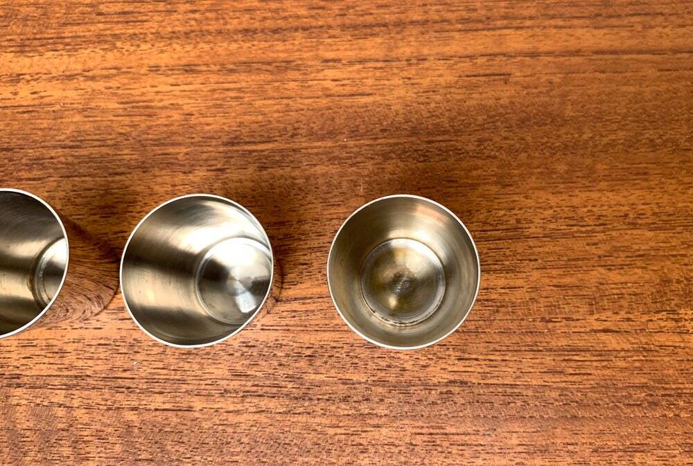 Set of 5 metal shot glasses in German owl style from the mid-century, 1960s.