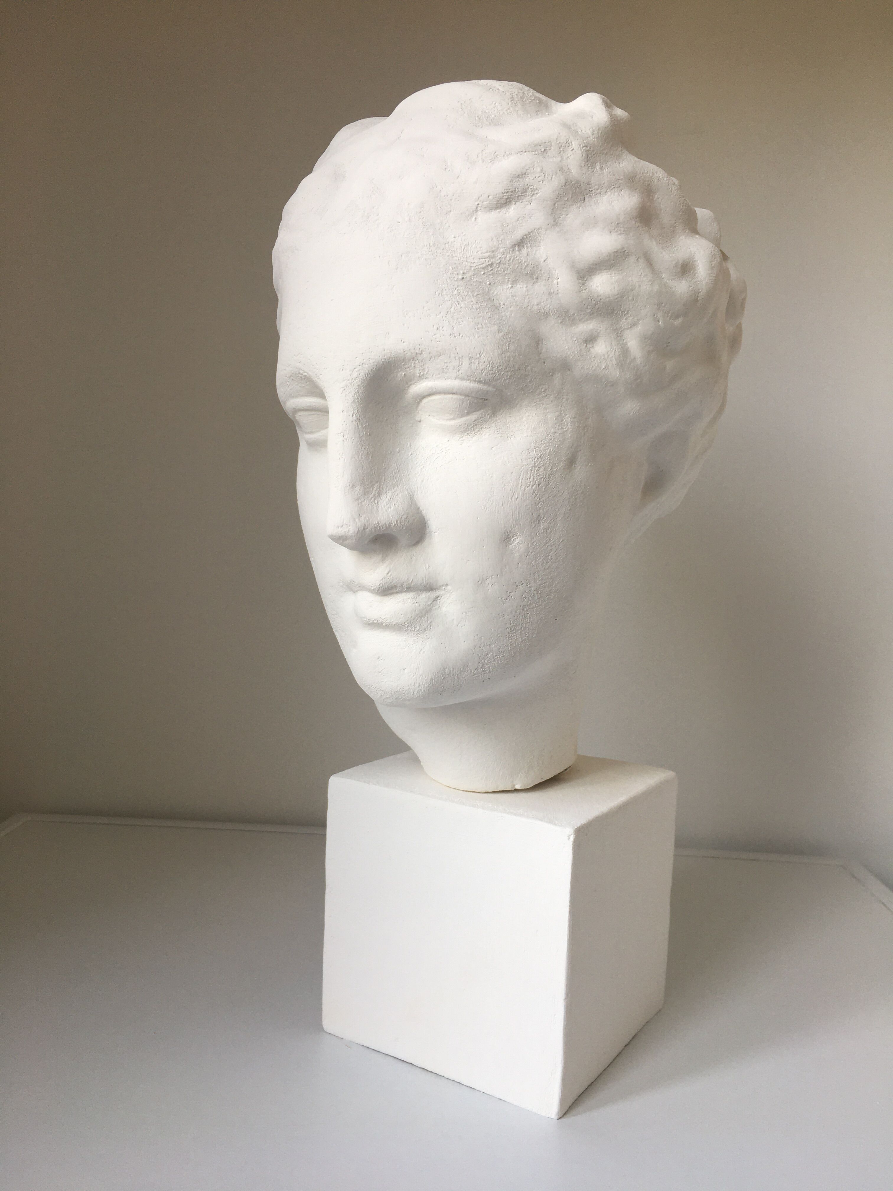 Greek Ap Hygie head. Scopas Hellenistic Greek art in plaster-bleached terracotta