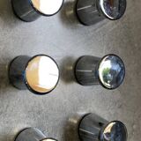 Stainless steel button for drawer or cabinet or shower wall.
