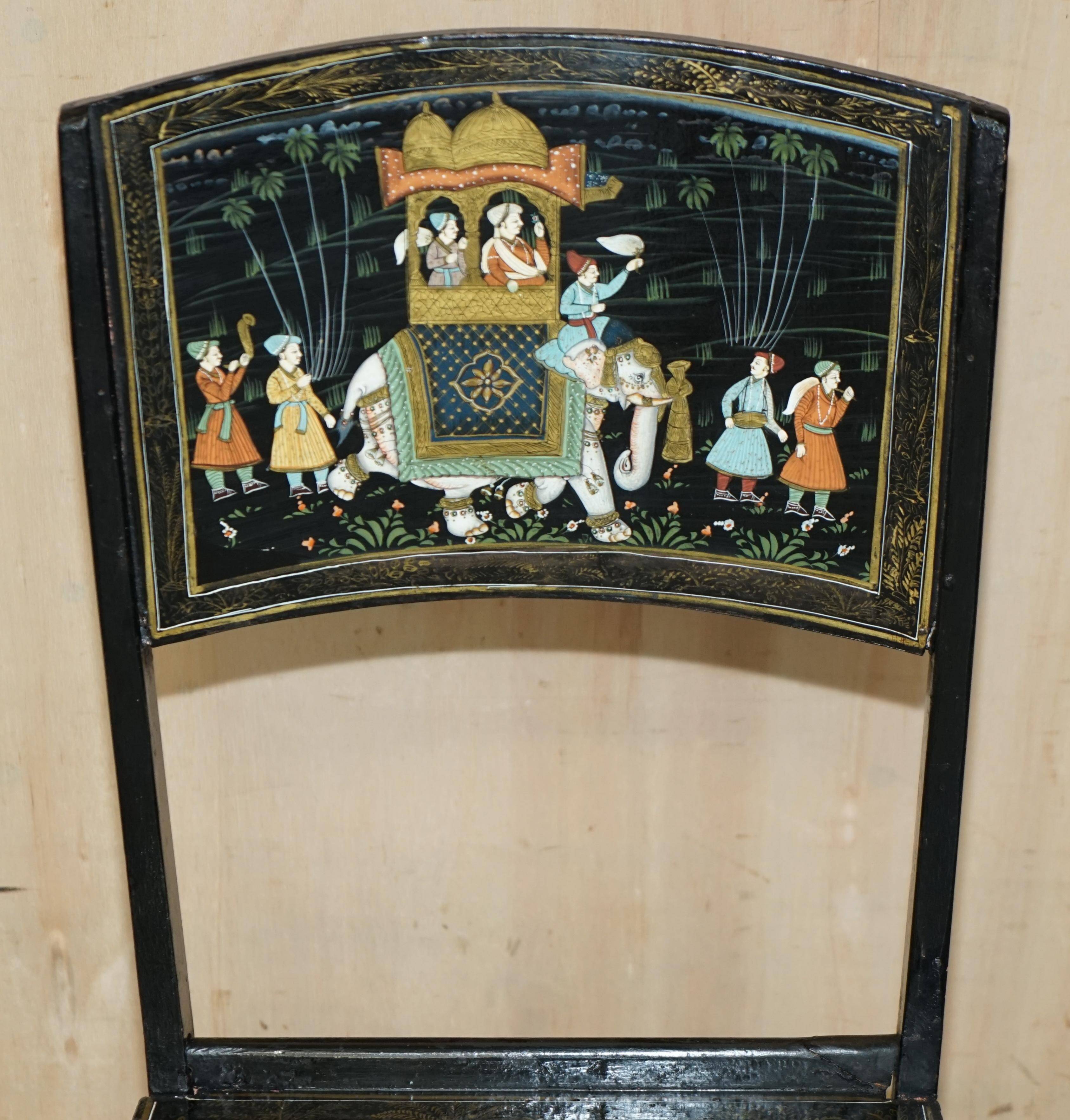 Pair of military folding chairs with Indian decoration.