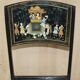 Pair of military folding chairs with Indian decoration.
