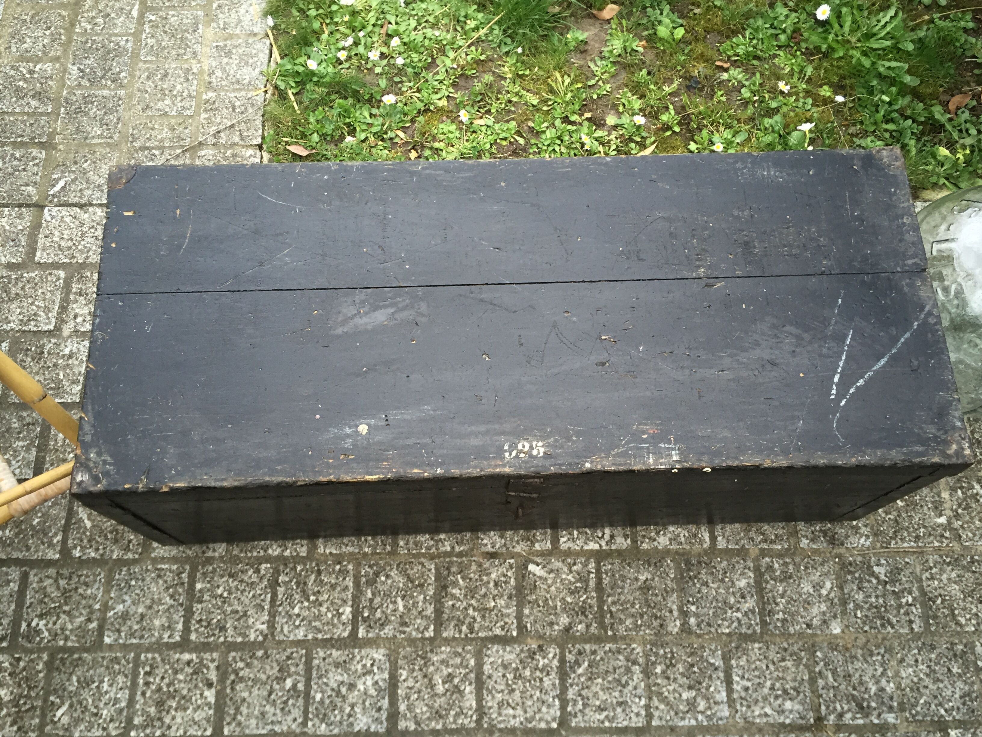 Old chest or wooden trunk black patina