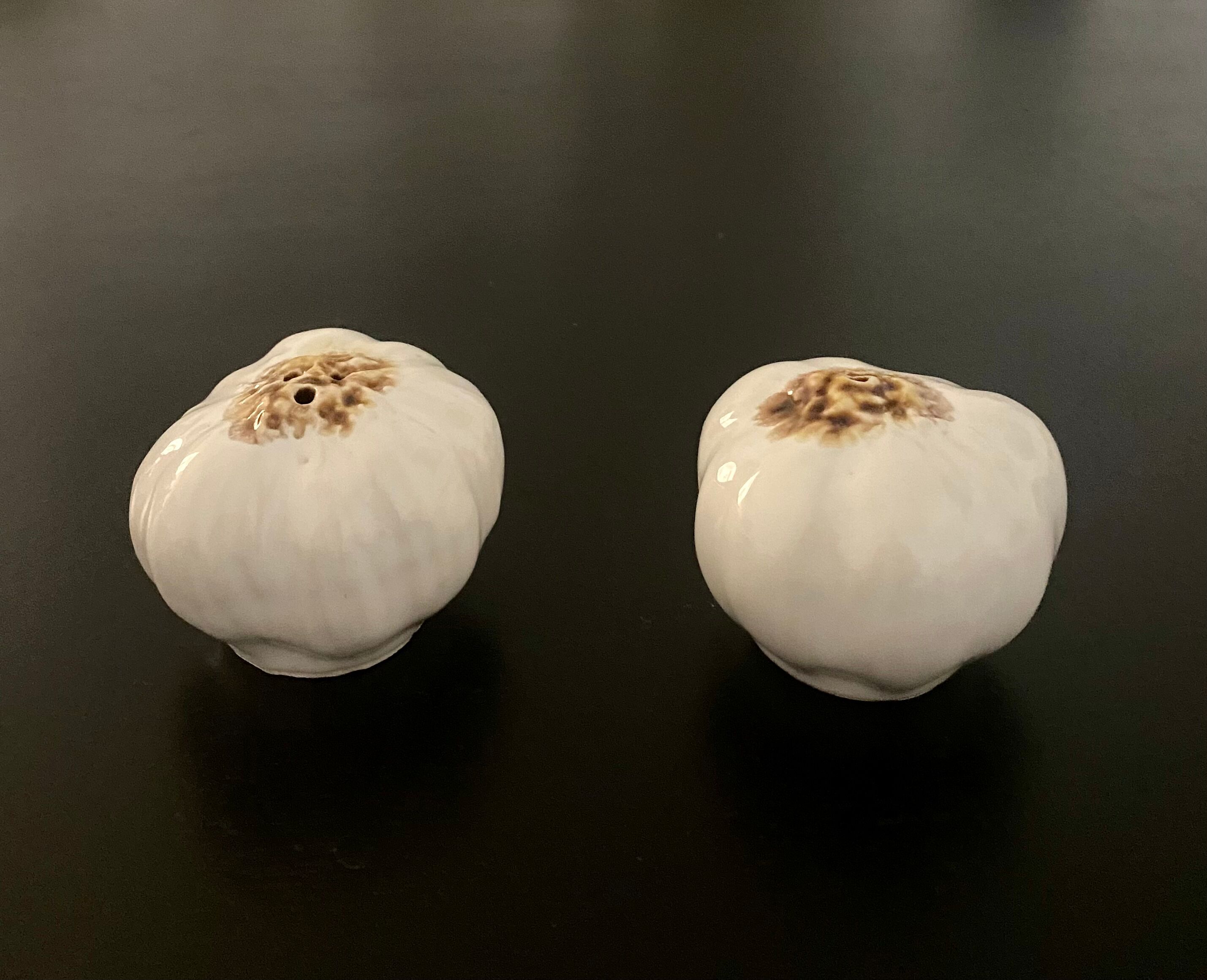 1 salt shaker and 1 pepper white garlic shape