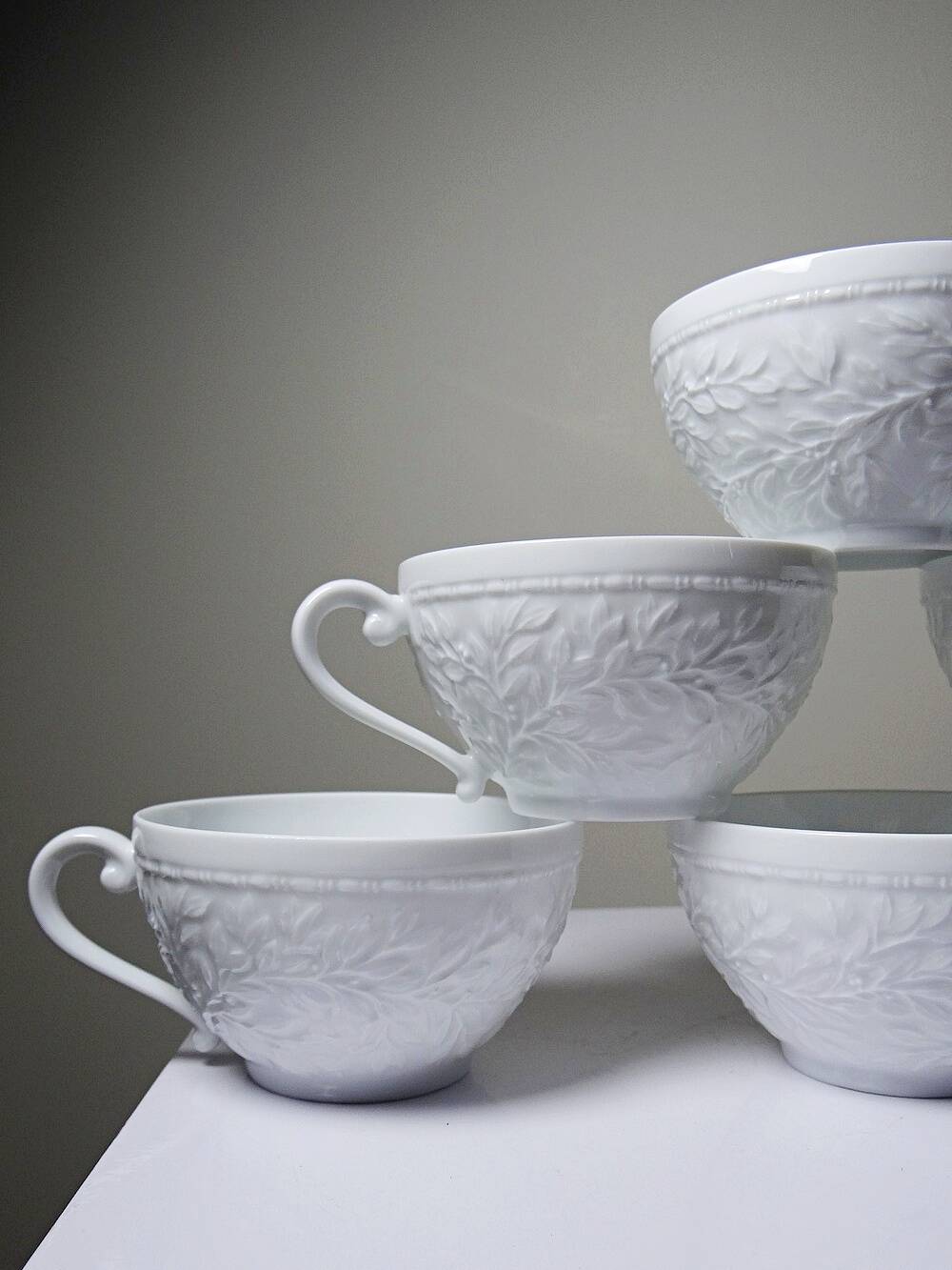 Set of 6 Bernardaud Limoges Louvre model white porcelain cups.