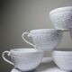 Set of 6 Bernardaud Limoges Louvre model white porcelain cups.