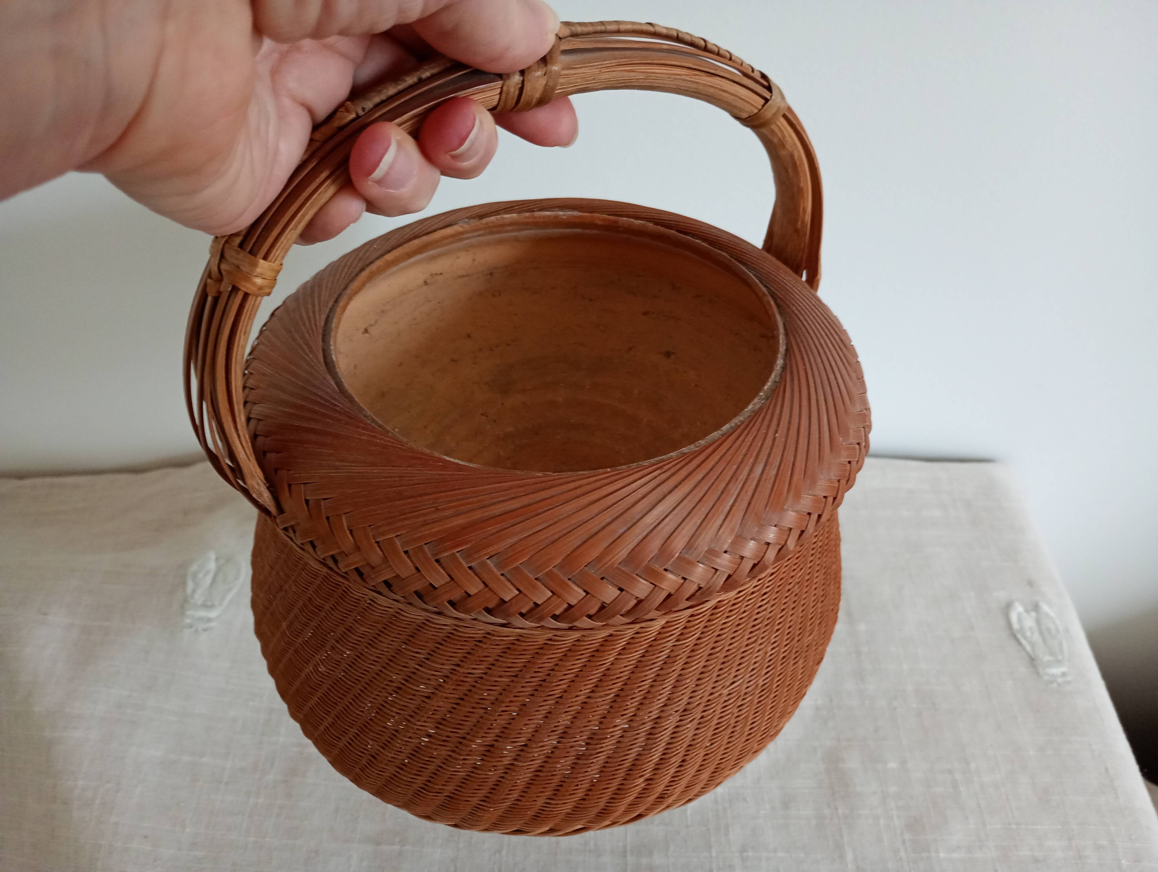 Woven bamboo basket and ceramic. Philippines.