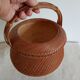 Woven bamboo basket and ceramic. Philippines.