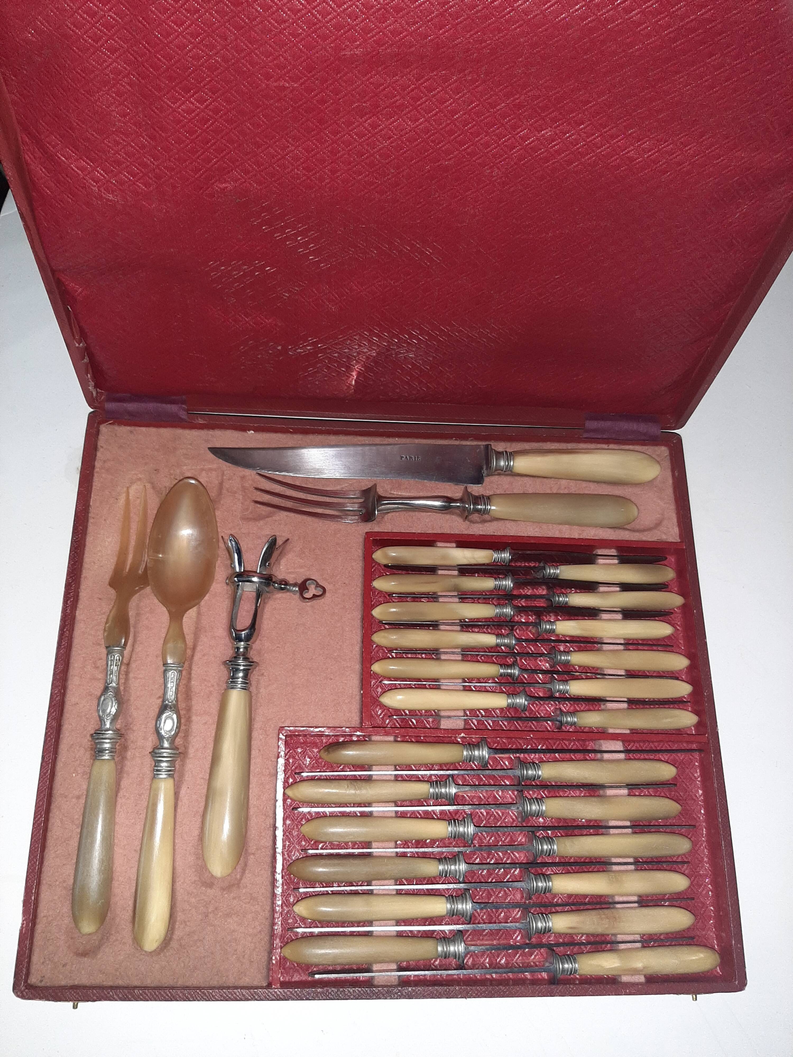 29-piece horn cutlery set, knives and serving utensils.