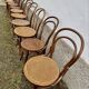 Set of 10 bentwood bistro chairs with cane seat.
