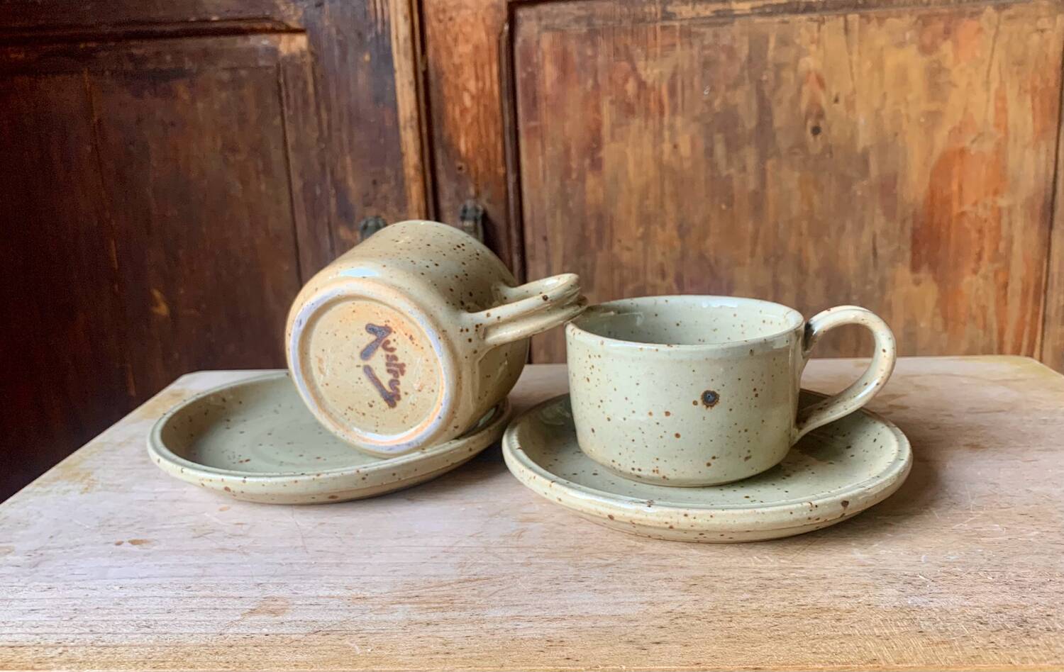 Two large Jean Austruy stoneware cups and saucers