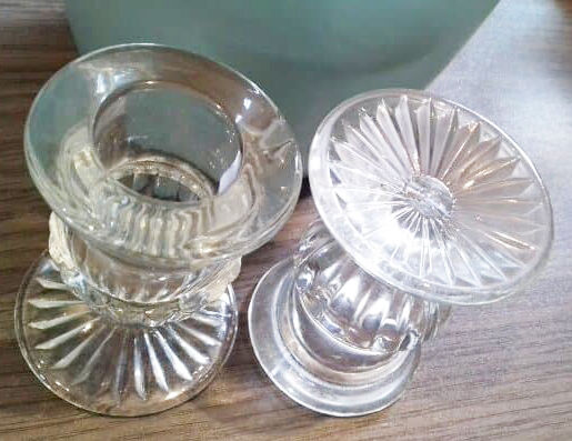 Duo of old glass candlesticks