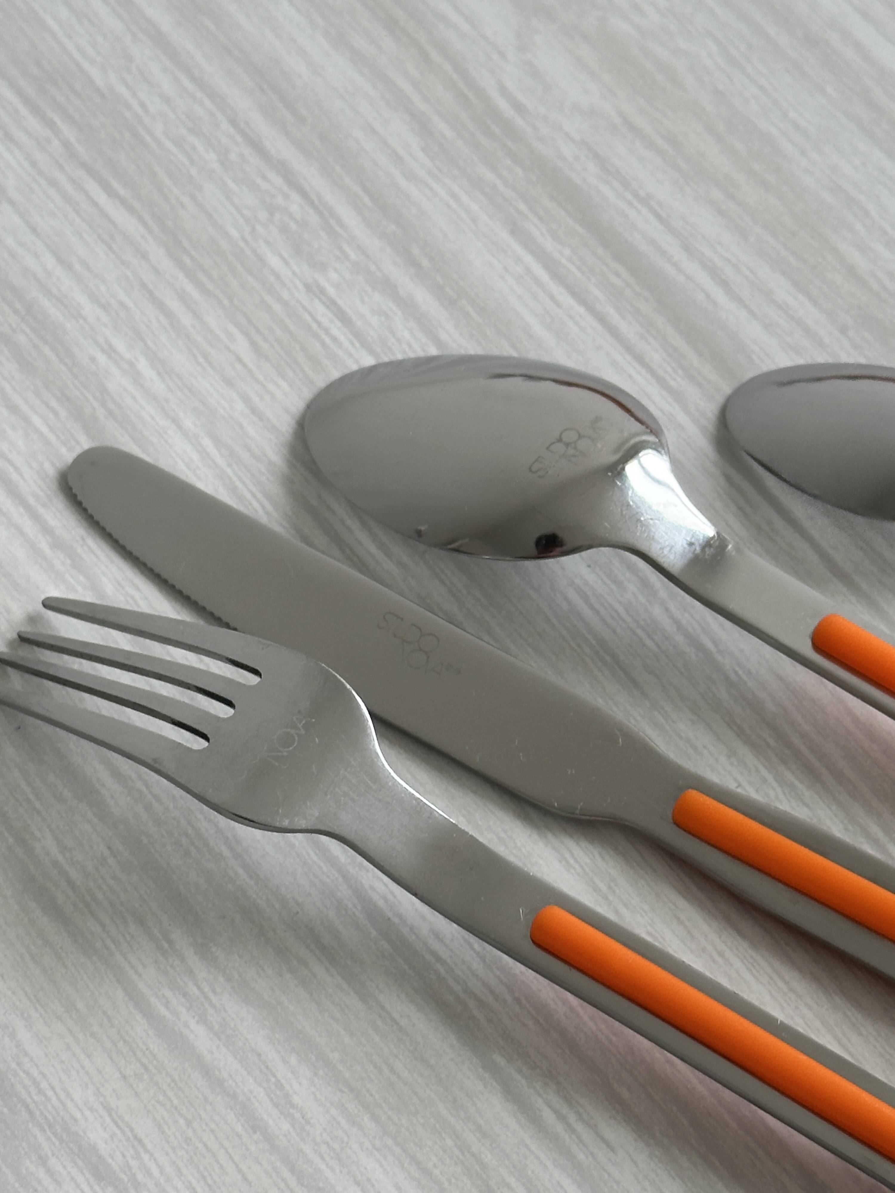 24 vintage stainless steel and orange plastic cutlery sets