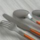 24 vintage stainless steel and orange plastic cutlery sets
