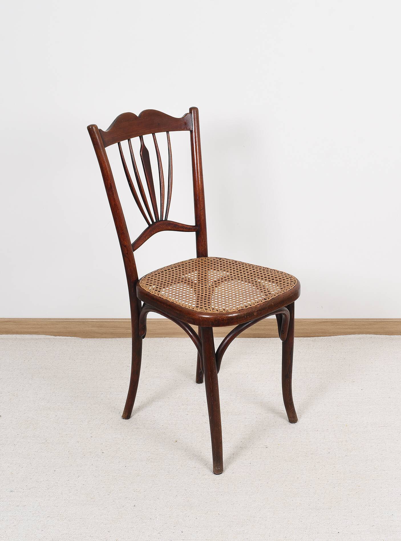 Old cane bistro chair, stamped fischel