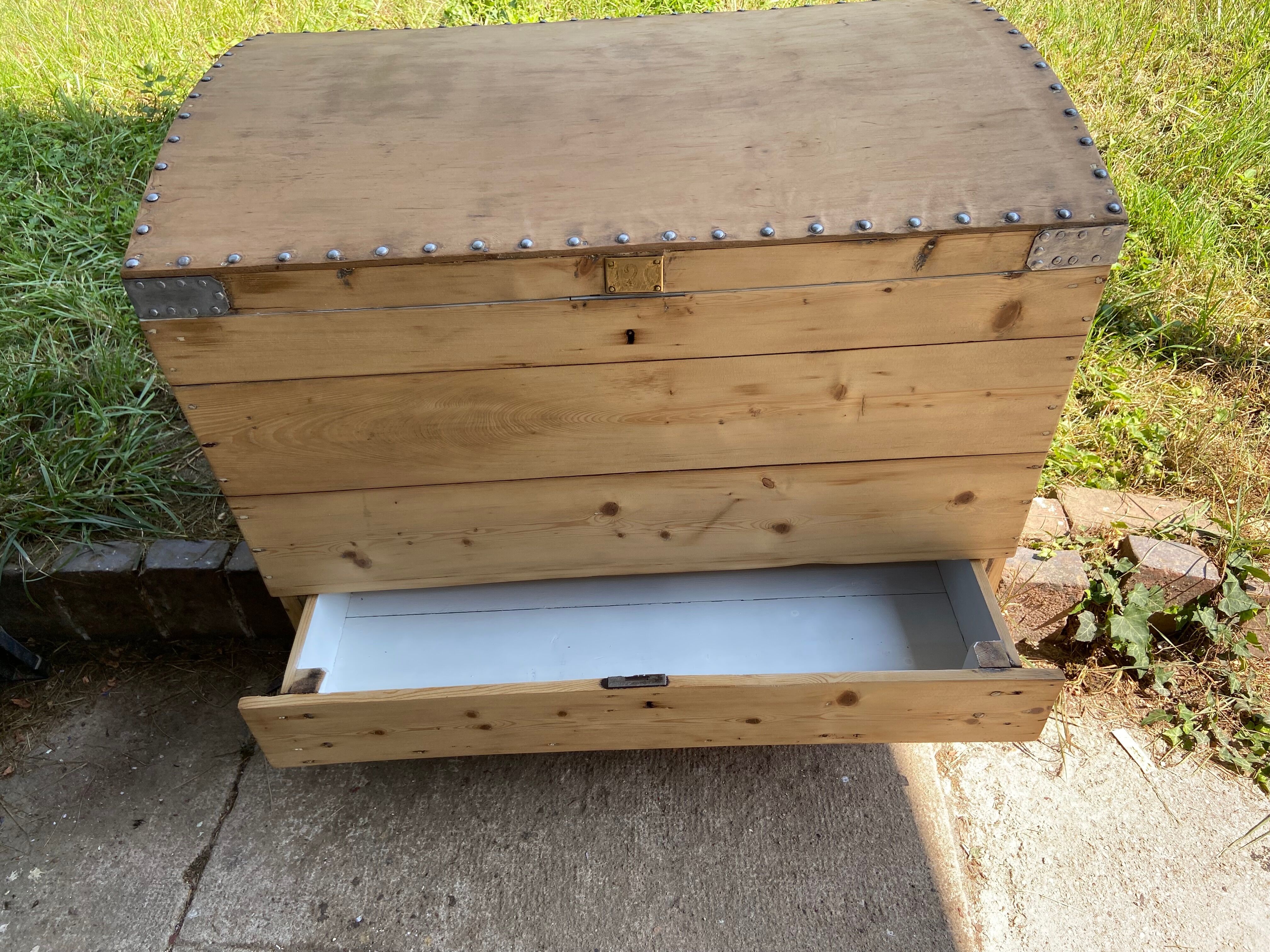 Raw wooden chest with a secret drawer