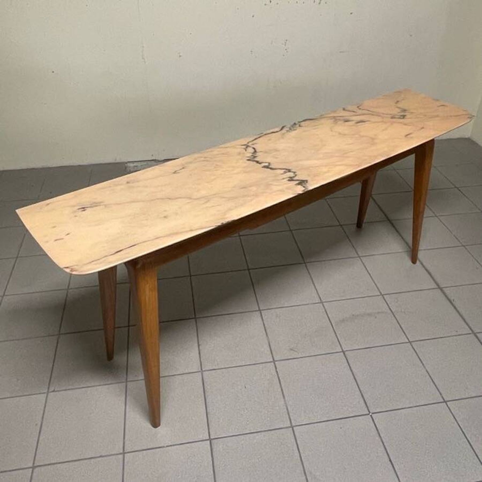 Console from the 1950s with a pink marble top and a cherry wood frame.