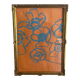 Gouache painting of blue flowers on an orange background