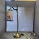 brass lamp that raises and lowers