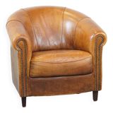 Sheep leather club chair in a cognac color with patina