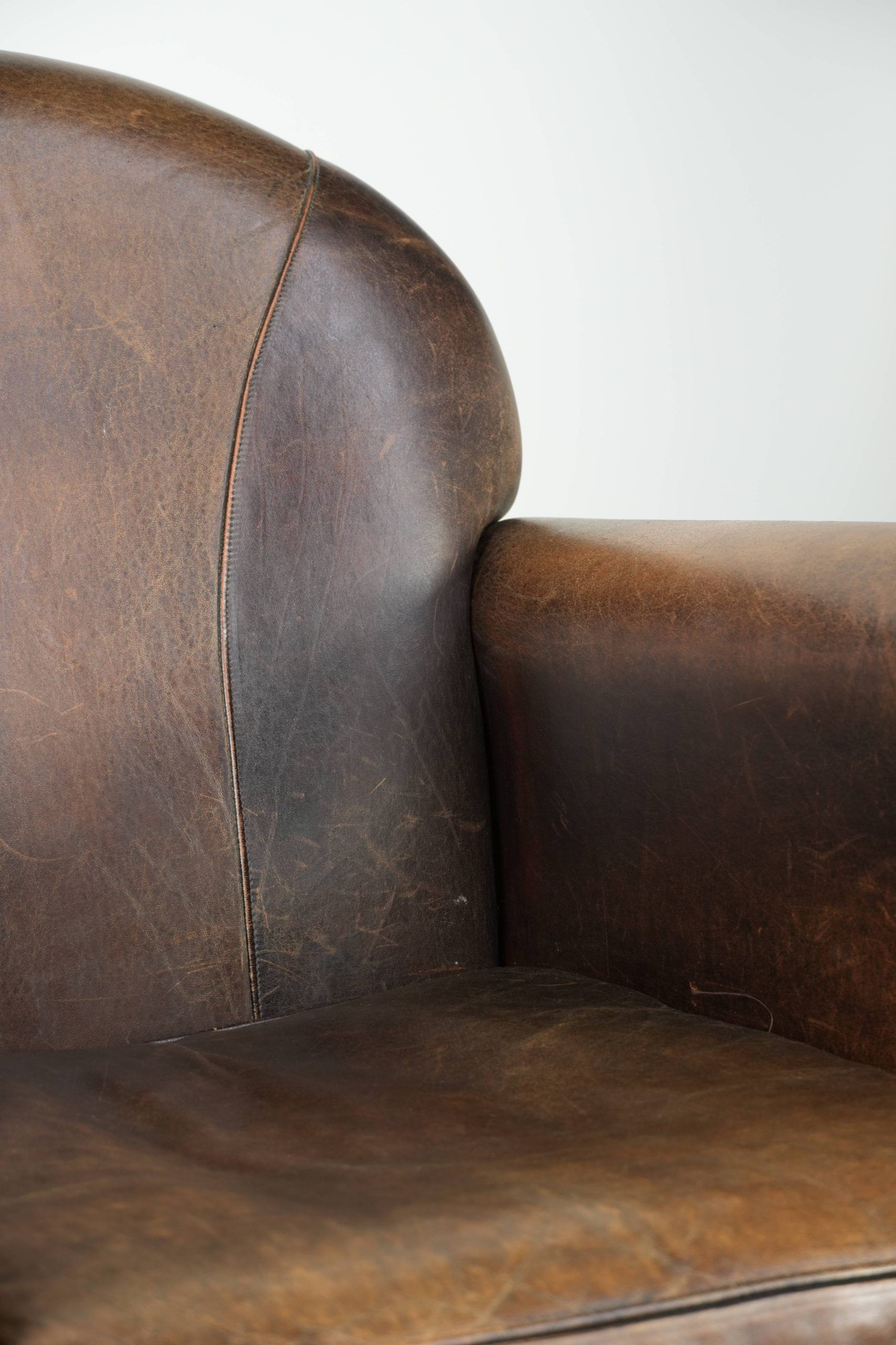 Armchair / lounge chair made of sheepskin leather with characterful patina
