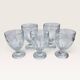 Set of 5 stemmed glasses made of pressed moulded glass.