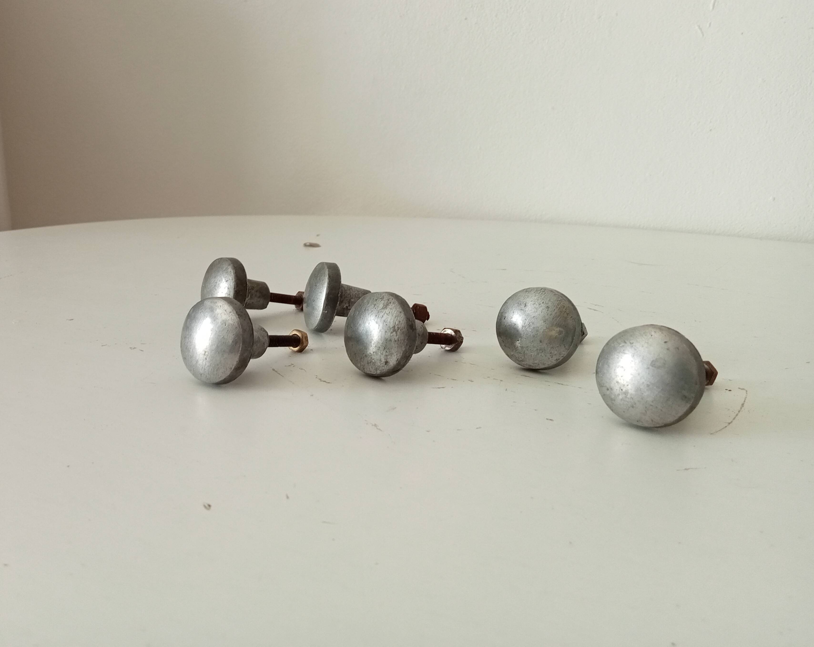 Pair of antique solid aluminium furniture handles.