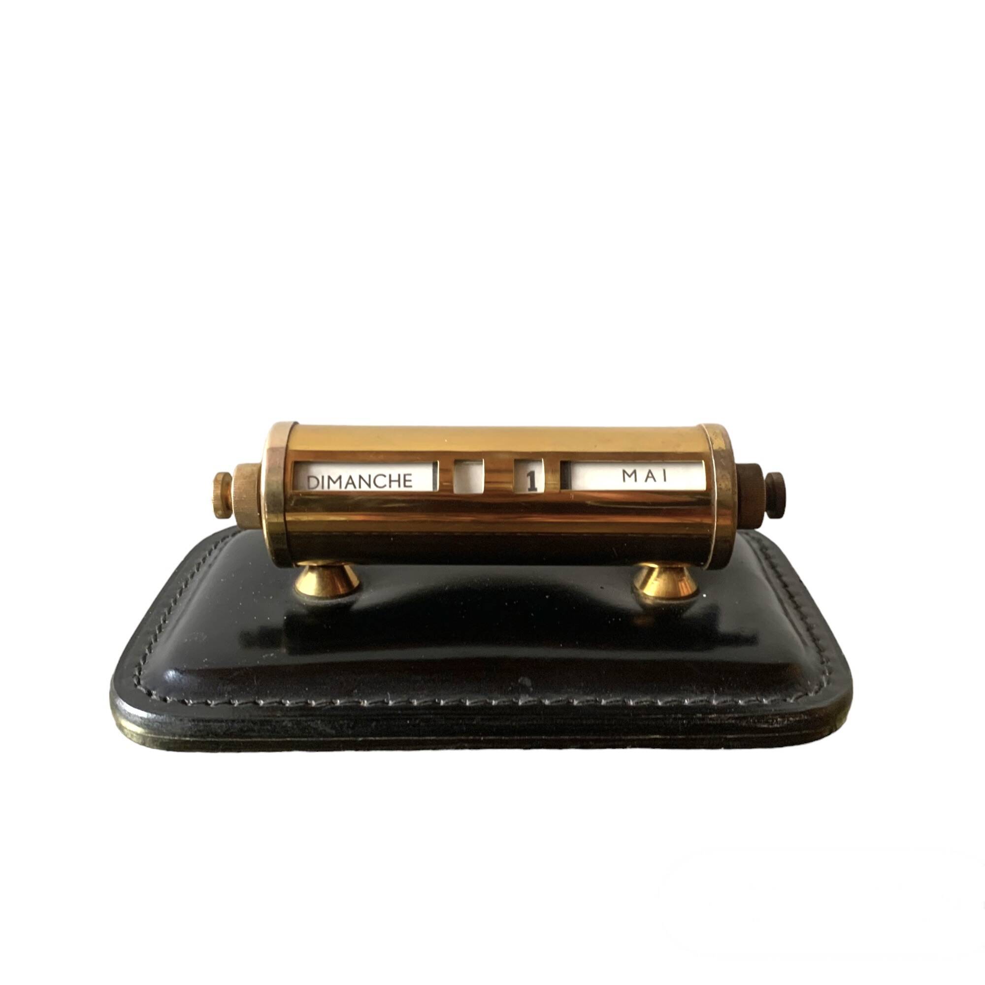 Old perpetual calendar in leather and brass