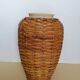 Rattan vase on ceramic