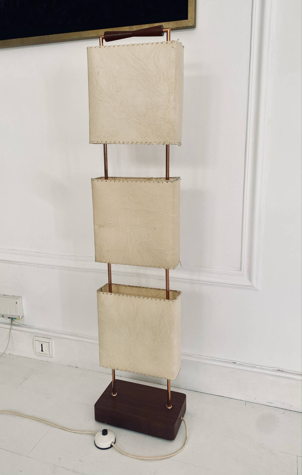 Wood and copper metal floor lamp with parchment.